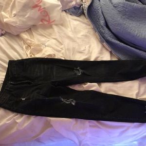Black ripped jeans, never worn brand new.